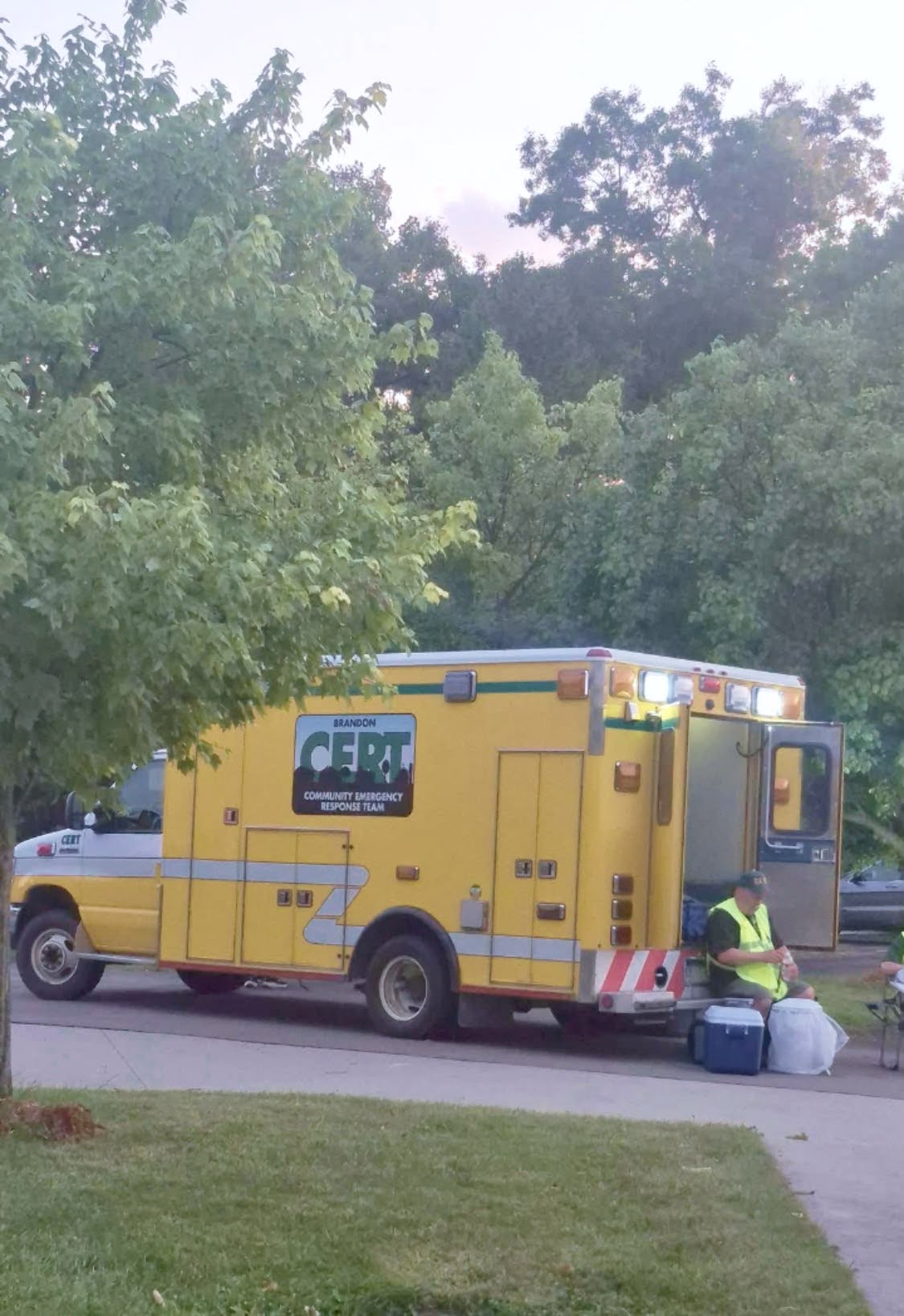 Brandon CERT vehicle and a volunteer outdoors in the July 4 photo