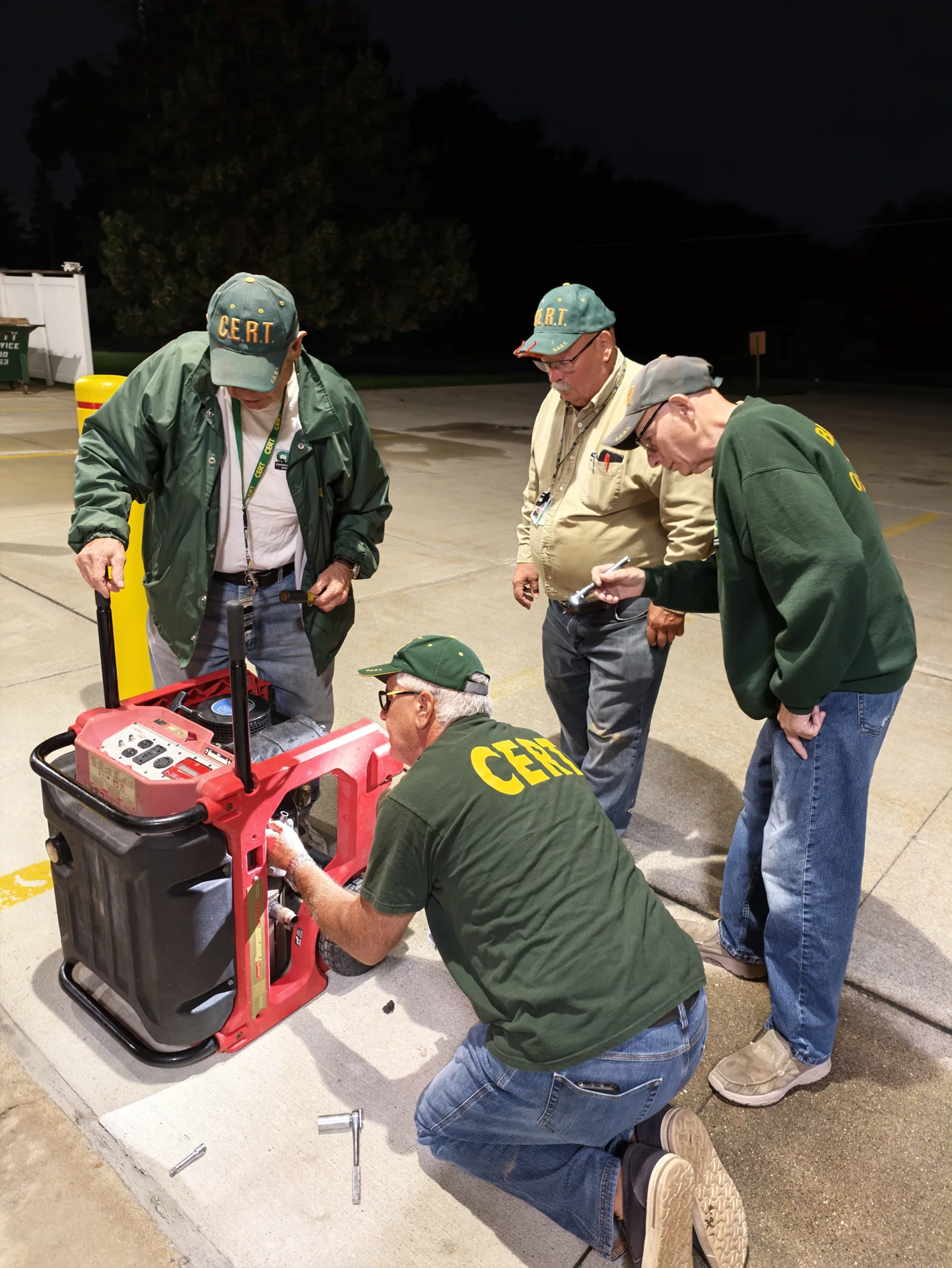 CERT team members working together on field equipment